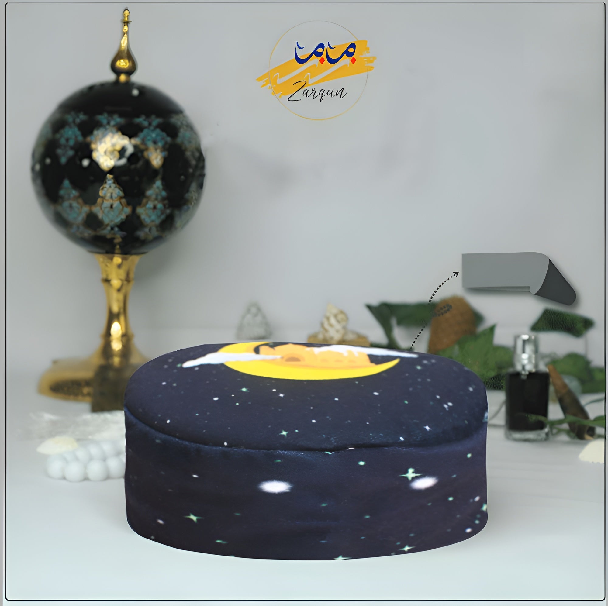 Celestial Moonlight Prayer Cap by Zamzam Zarqun LLC, featuring intricate moon and star embroidery on a dark fabric cap.