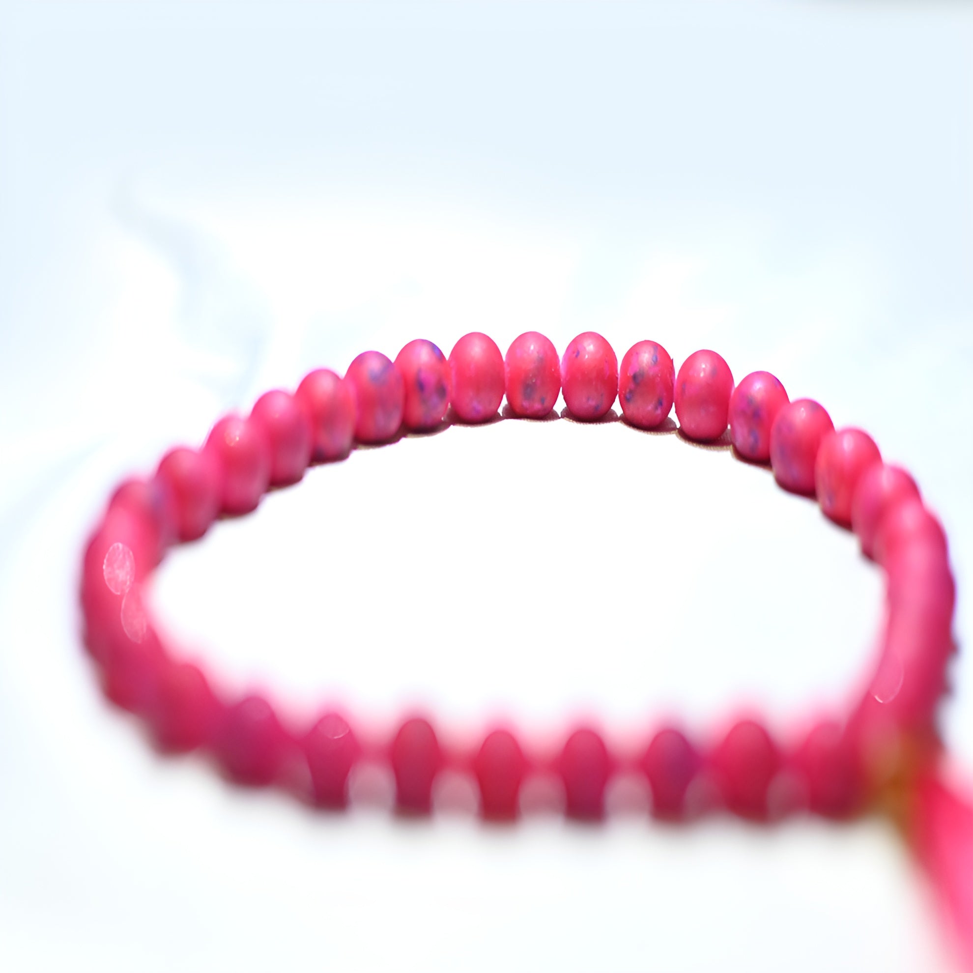 Zamzam Zarqun LLC prayer beads with intricate design, displayed on a prayer mat for spiritual practice and meditation.