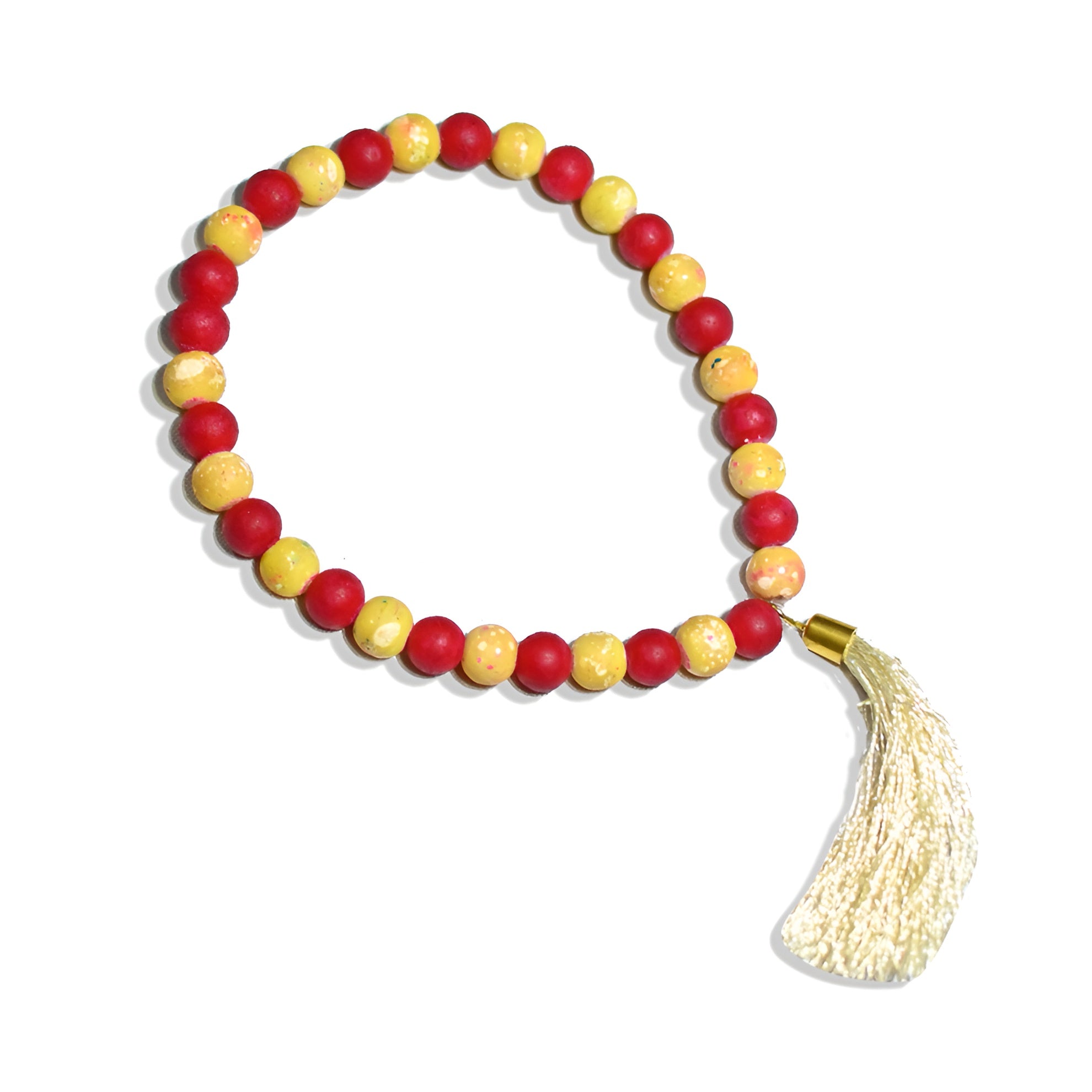 Zamzam Zarqun LLC Scarlet Solace prayer beads with intricate design, held in hand against a soft background.