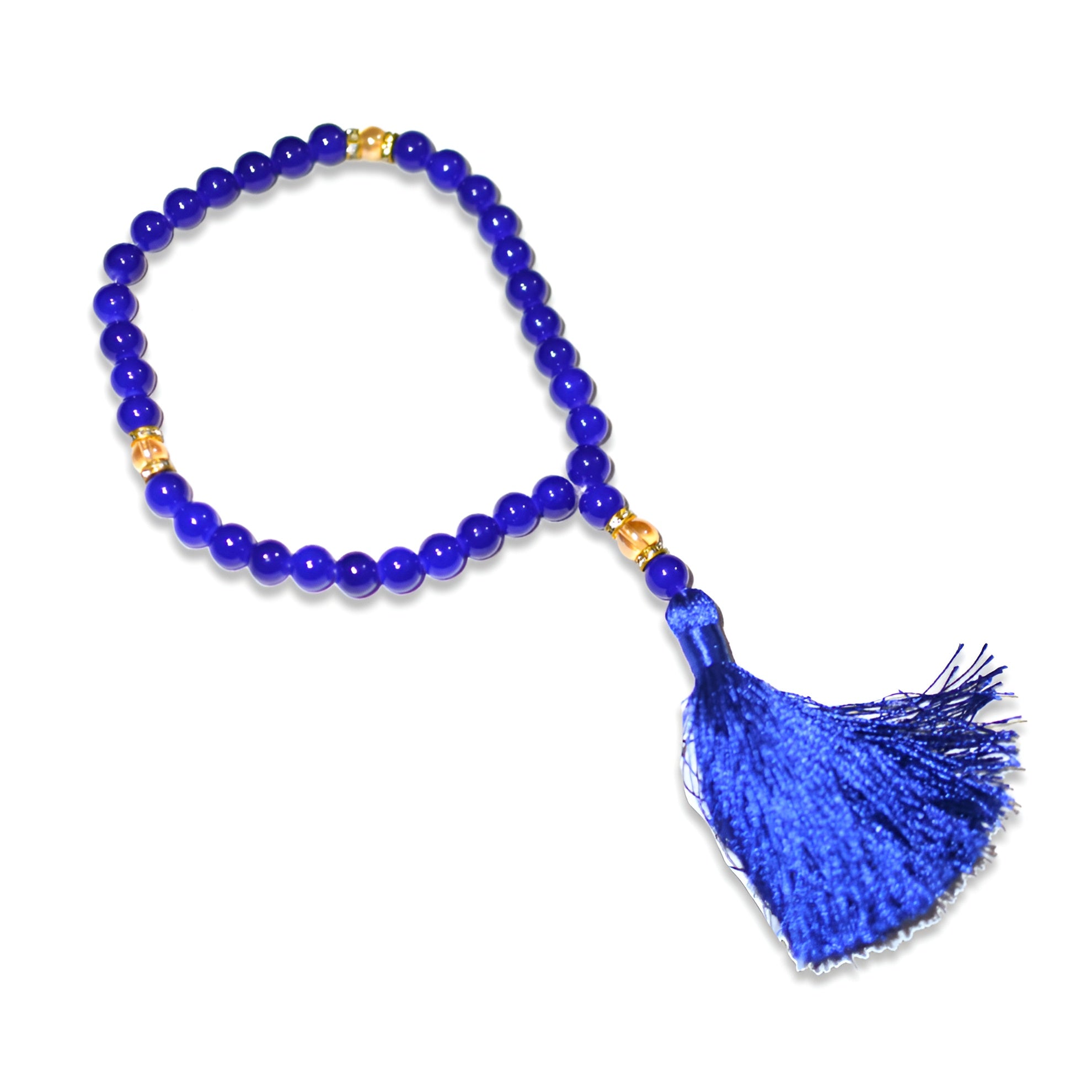Zamzam Zarqun LLC glow swan prayer beads with intricate designs, displayed alongside a patterned prayer rug.