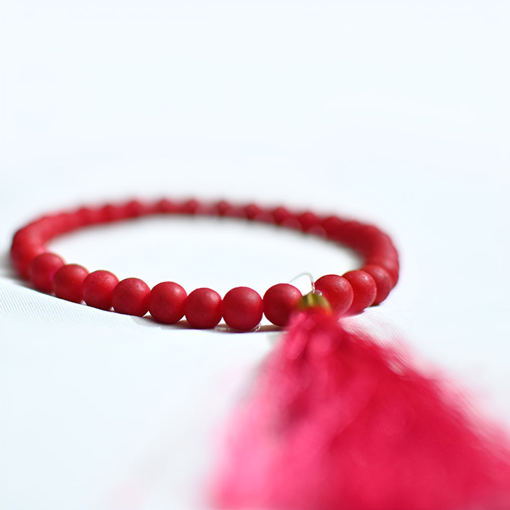 Majestic rose prayer beads from Zamzam Zarqun LLC with a string of rose-colored prayer beads and a decorative tassel.