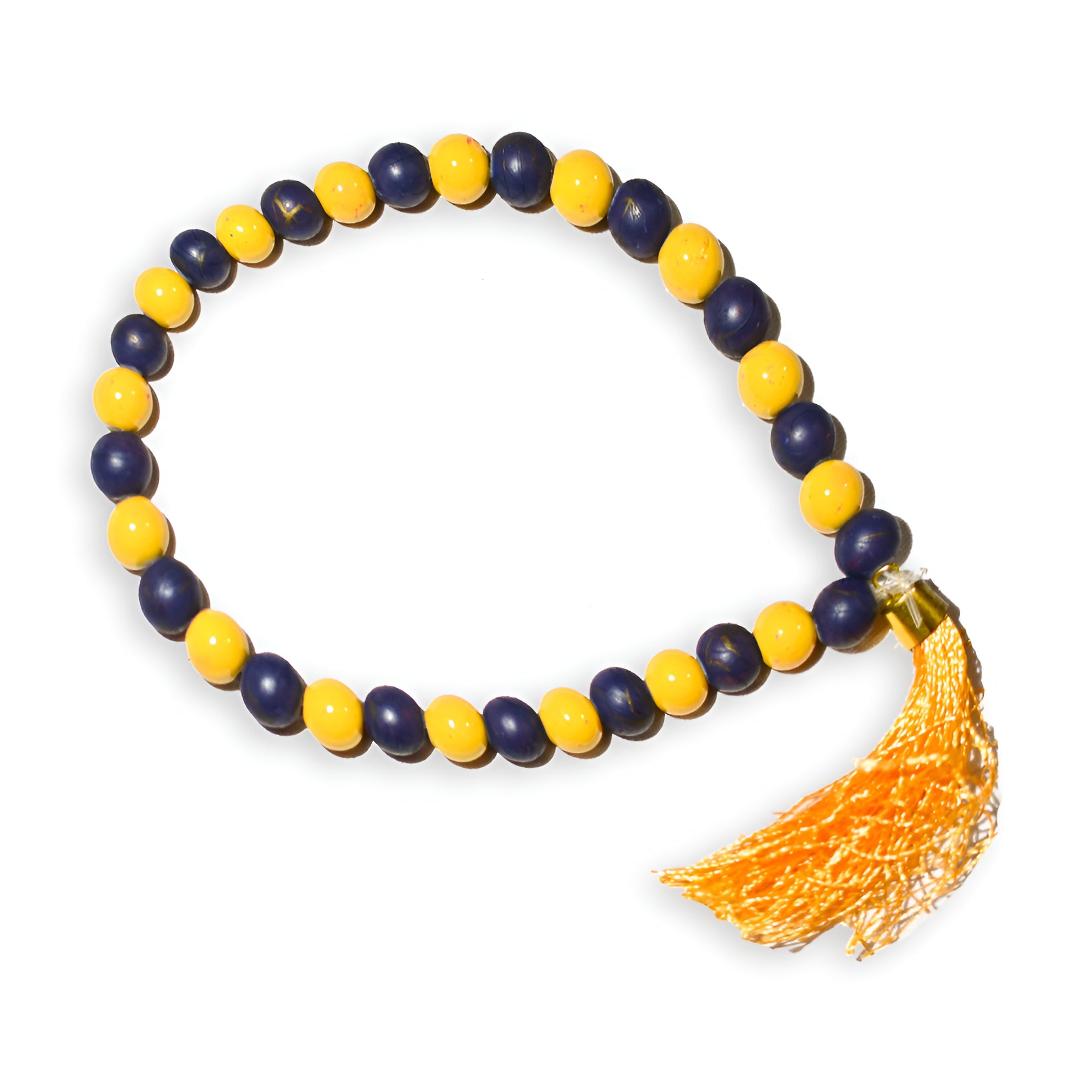 Serene Sands prayer beads from Zamzam Zarqun LLC with intricate design, displayed alongside a prayer mat.