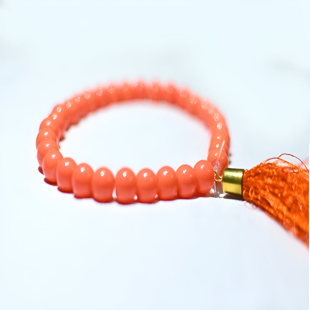 Zamzam Zarqun LLC prayer beads with intricate design, arranged on a Janamaz for Islamic prayer ritual.