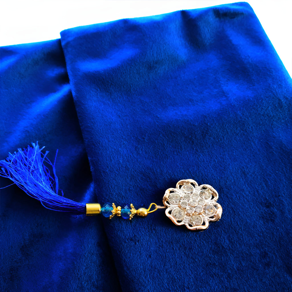 Blue velvet Quran set with cover by Zamzam Zarqun LLC, featuring intricate designs and a matching protective cover.