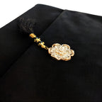Black velvet Quran set with cover by Zamzam Zarqun LLC, featuring intricate design and traditional Islamic calligraphy.