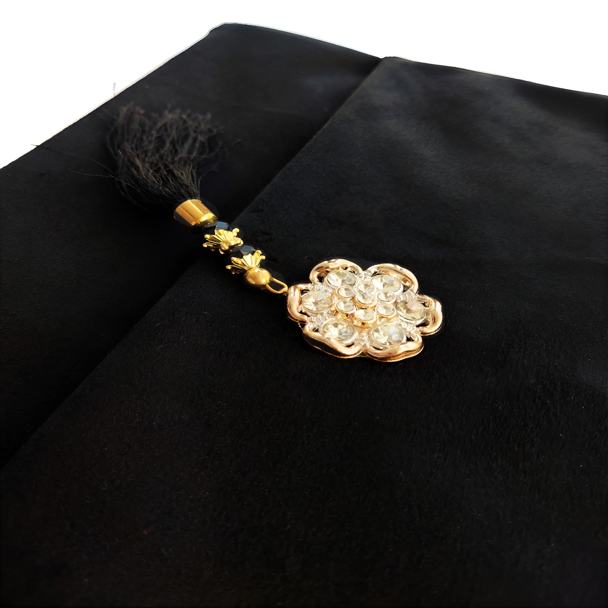 Black velvet Quran set with cover by Zamzam Zarqun LLC, featuring intricate design and traditional Islamic calligraphy.