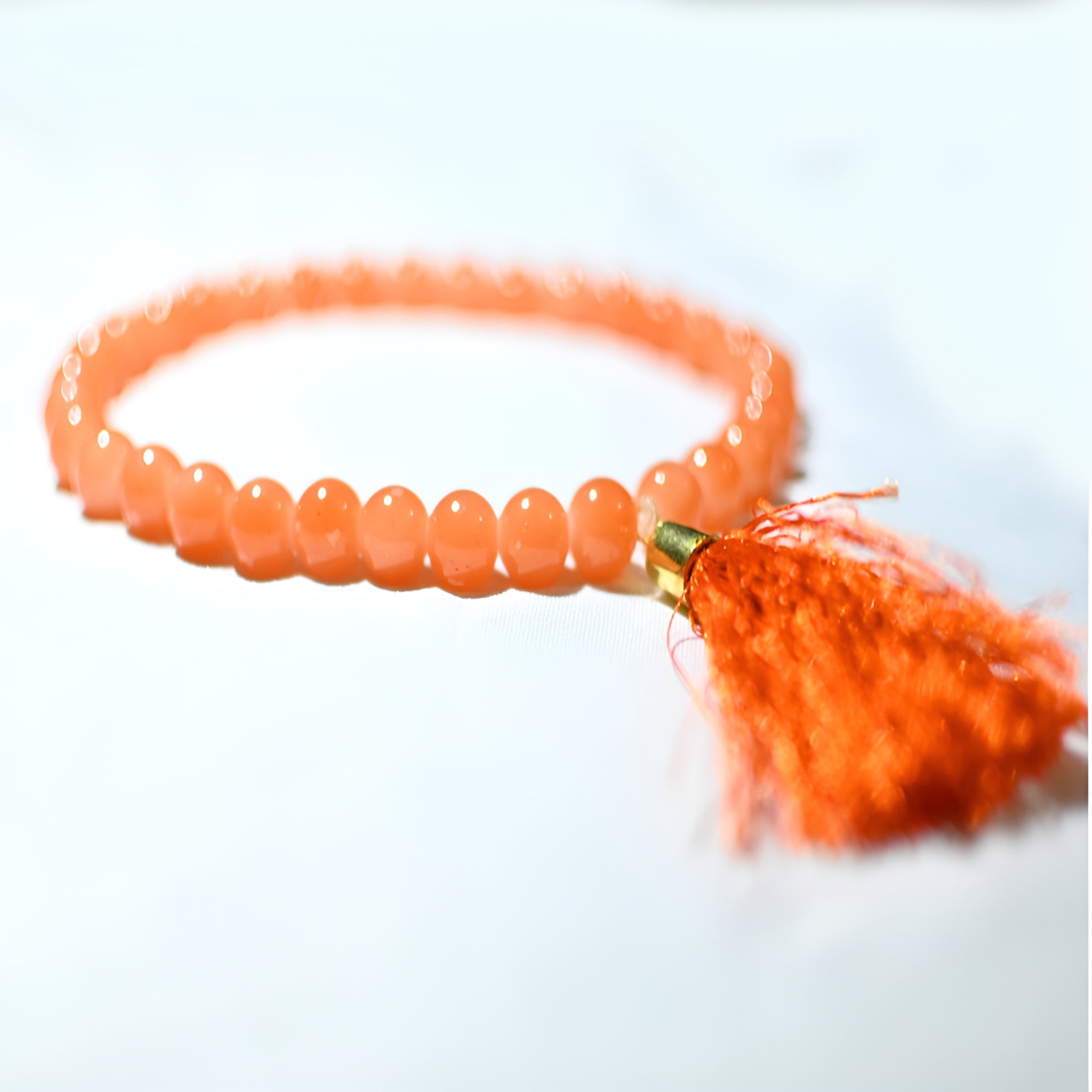 Al Zarqun prayer beads from Zamzam Zarqun LLC with black and gold design, featuring multiple beaded strands and a decorative tassel.